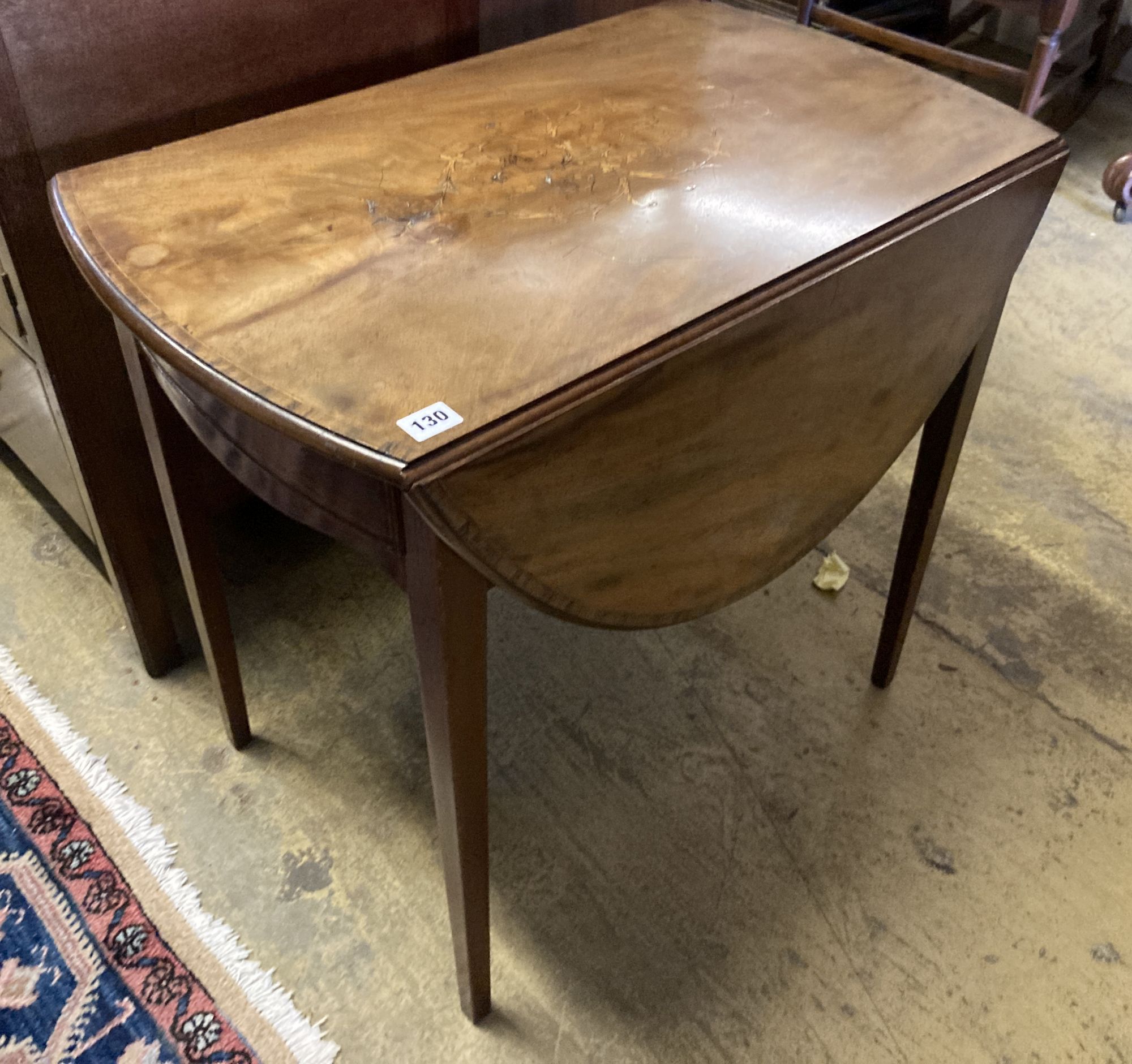 A George III marquetry inlaid oval mahogany Pembroke table, width 74cm, depth 46cm, height 66cm